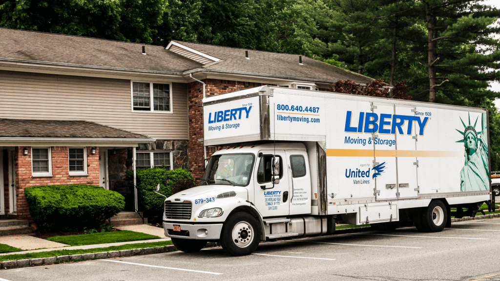 Liberty moving truck in front of house